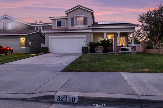 32110 Camino Herencia, Temecula, CA 92592 - traditional-style house featuring covered porch, a front lawn, solar panels, driveway, and a garage