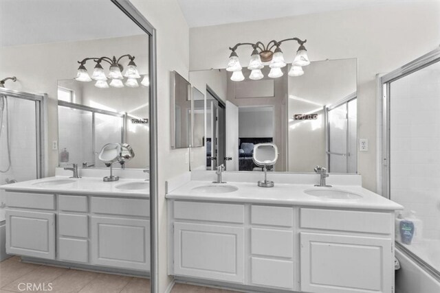 32110 Camino Herencia, Temecula, CA 92592 - full bathroom featuring double vanity, enclosed tub / shower combo, and tile patterned flooring