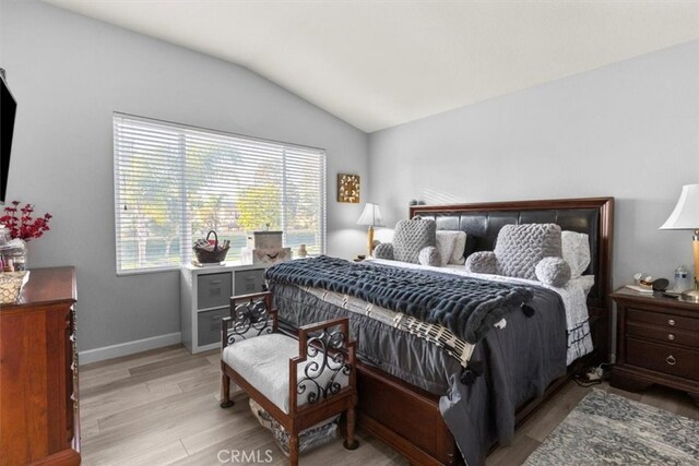 32110 Camino Herencia, Temecula, CA 92592 - bedroom with vaulted ceiling and light wood-style floors