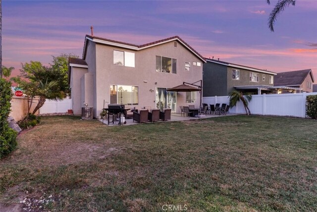 32110 Camino Herencia, Temecula, CA 92592 - rear view of property with an outdoor living space, a fenced backyard, stucco siding, and a patio