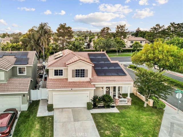 32110 Camino Herencia, Temecula, CA 92592 - view of front of property with stucco siding, solar panels, concrete driveway, and covered porch