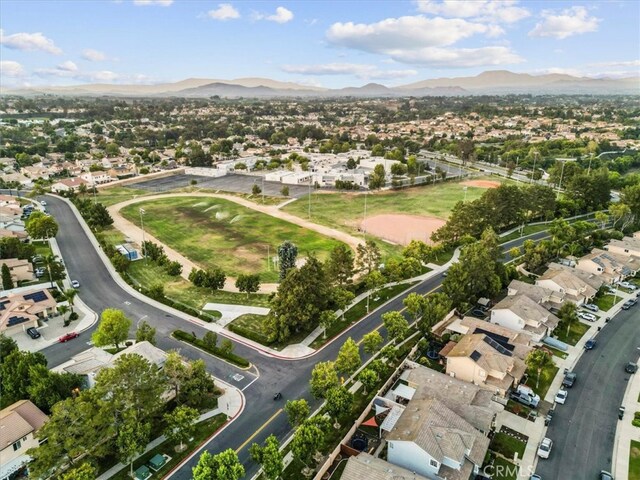 32110 Camino Herencia, Temecula, CA 92592 - aerial view of property and surrounding area with a mountain backdrop and nearby suburban area