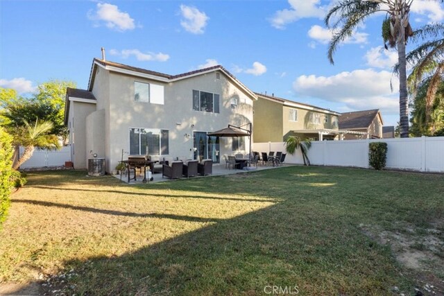 32110 Camino Herencia, Temecula, CA 92592 - back of property with outdoor lounge area, a fenced backyard, and stucco siding