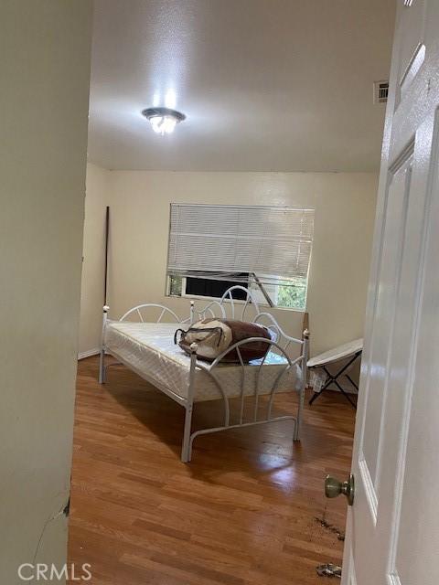 1618 W Burnett, Long Beach, CA 90810 - bedroom with wood finished floors and cooling unit