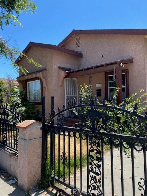 1618 W Burnett, Long Beach, CA 90810 - view of front of house with a gate and stucco siding