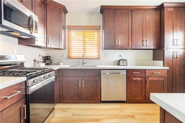 239 W Hillcrest Blvd, Inglewood, CA 90301 - kitchen featuring stainless steel appliances, light countertops, and light wood-type flooring