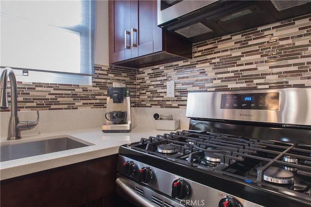 239 W Hillcrest Blvd, Inglewood, CA 90301 - kitchen featuring stainless steel gas range oven, light countertops, and tasteful backsplash