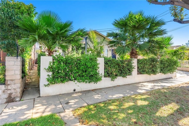 239 W Hillcrest Blvd, Inglewood, CA 90301 - view of side of home with a fenced front yard and stucco siding