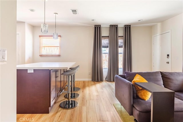 239 W Hillcrest Blvd, Inglewood, CA 90301 - bar featuring light wood-style floors and hanging light fixtures