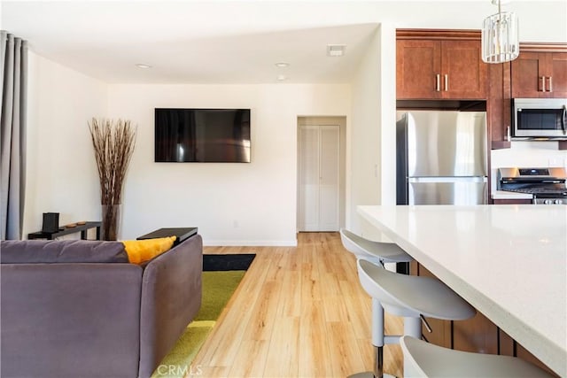 239 W Hillcrest Blvd, Inglewood, CA 90301 - living area featuring light wood finished floors and recessed lighting