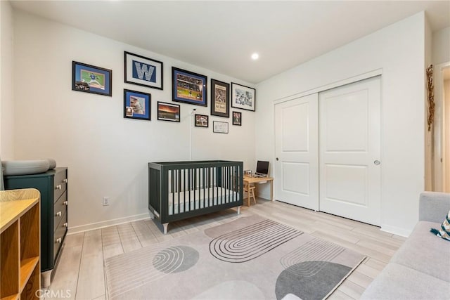 304 Floral Vw, Irvine, CA 92618 - bedroom with light wood finished floors, a desk, a closet, recessed lighting, and a crib