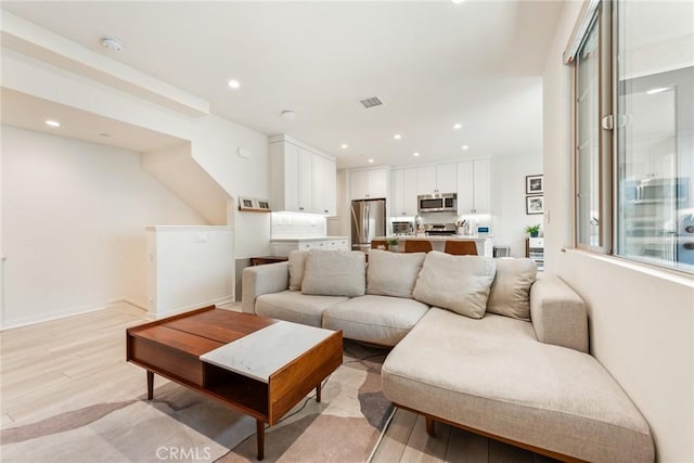 304 Floral Vw, Irvine, CA 92618 - living area featuring light wood-style floors and recessed lighting