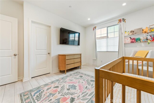 304 Floral Vw, Irvine, CA 92618 - bedroom with wood finished floors, recessed lighting, and a crib