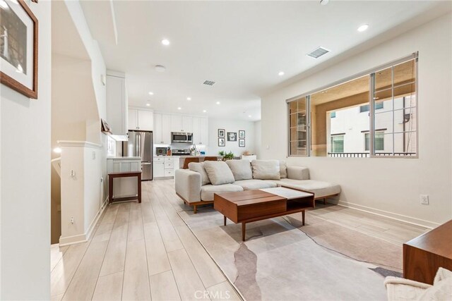 304 Floral Vw, Irvine, CA 92618 - living area featuring light wood-style floors and recessed lighting