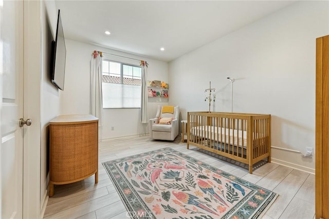 304 Floral Vw, Irvine, CA 92618 - bedroom featuring light wood-type flooring, a nursery area, and recessed lighting