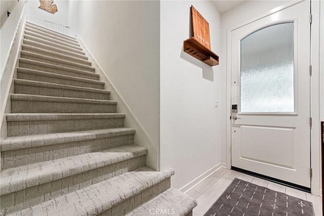 304 Floral Vw, Irvine, CA 92618 - doorway with stairway and light tile patterned flooring