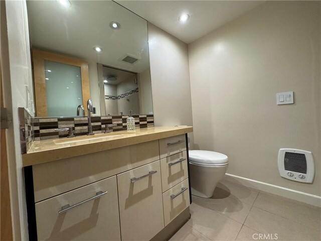 1688 Palisades Dr, Pacific Palisades, CA 90272 - bathroom with vanity, tasteful backsplash, tile patterned flooring, recessed lighting, and heating unit