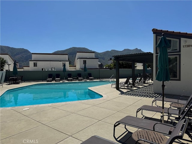 1688 Palisades Dr, Pacific Palisades, CA 90272 - community pool with a mountain view, a pergola, and a patio
