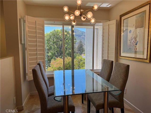 1688 Palisades Dr, Pacific Palisades, CA 90272 - dining area with a chandelier and baseboards