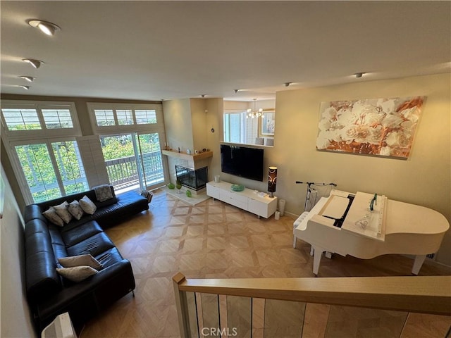 1688 Palisades Dr, Pacific Palisades, CA 90272 - living room with a chandelier and a glass covered fireplace