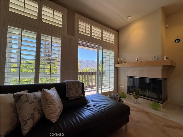 1688 Palisades Dr, Pacific Palisades, CA 90272 - living room featuring a glass covered fireplace and a mountain view