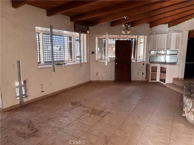 73455 Helms Rd, Desert Hot Springs, CA 92241 - unfurnished living room with wooden ceiling and light tile patterned floors