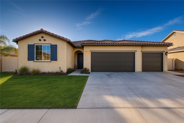 1246 Venice Ave, Mentone, CA 92359 - mediterranean / spanish home with a garage, driveway, stucco siding, and a tile roof