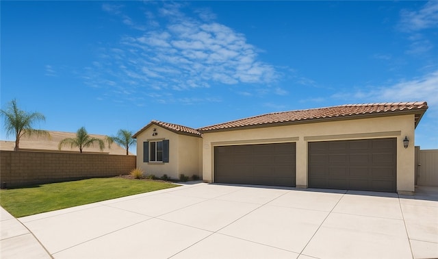 1246 Venice Ave, Mentone, CA 92359 - mediterranean / spanish-style house featuring driveway, stucco siding, and a garage