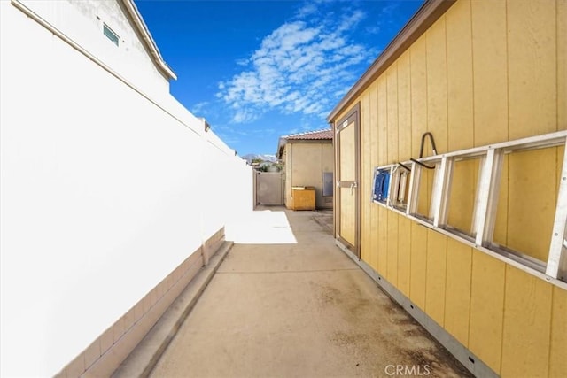 1246 Venice Ave, Mentone, CA 92359 - view of side of home with a patio area