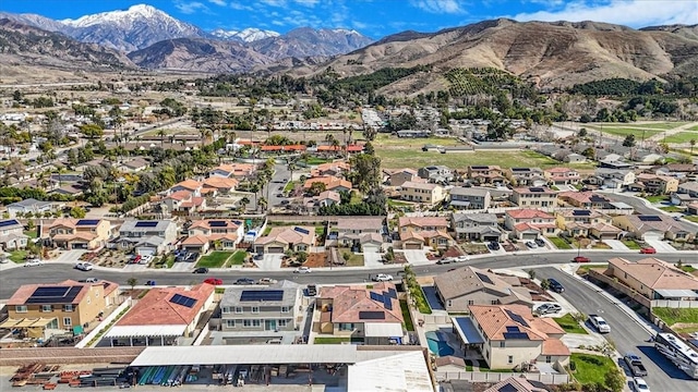 1246 Venice Ave, Mentone, CA 92359 - aerial overview of property's location featuring a mountainous background and nearby suburban area