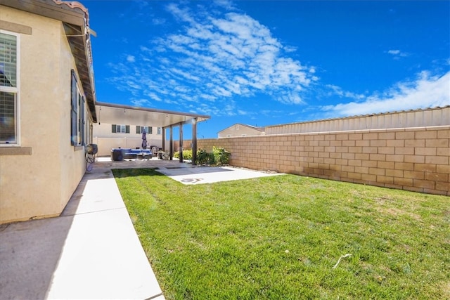 1246 Venice Ave, Mentone, CA 92359 - fenced backyard with a patio