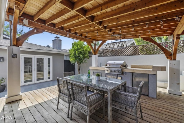 4961 Alcove Ave, Valley Village, CA 91607 - deck with exterior kitchen, french doors, and outdoor dining area
