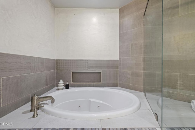 4961 Alcove Ave, Valley Village, CA 91607 - full bath featuring a tub with jets and a fireplace