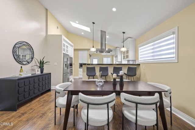 4961 Alcove Ave, Valley Village, CA 91607 - dining room featuring a skylight, lofted ceiling, dark wood-style flooring, and recessed lighting