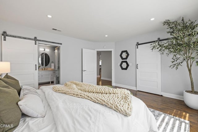 4961 Alcove Ave, Valley Village, CA 91607 - bedroom with a barn door, wood finished floors, recessed lighting, and ensuite bath