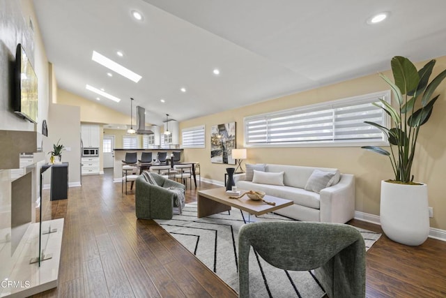 4961 Alcove Ave, Valley Village, CA 91607 - living room featuring vaulted ceiling, a skylight, wood-type flooring, and recessed lighting