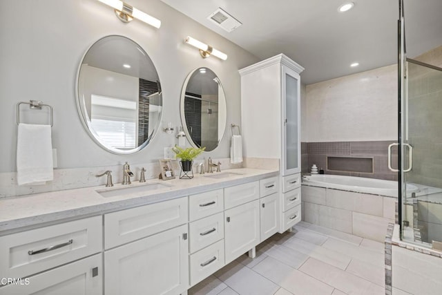 4961 Alcove Ave, Valley Village, CA 91607 - full bath featuring double vanity, a bath, tile patterned floors, a shower stall, and recessed lighting