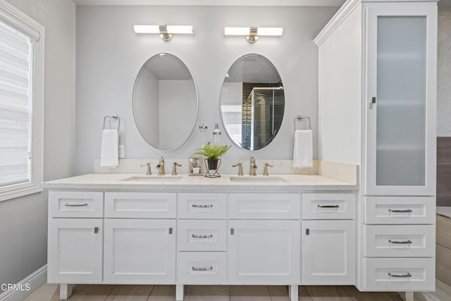 4961 Alcove Ave, Valley Village, CA 91607 - bathroom with double vanity, tile patterned flooring, and healthy amount of natural light
