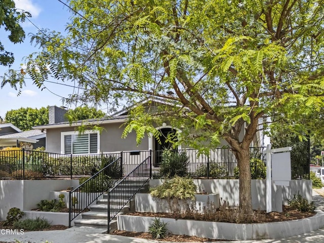 4961 Alcove Ave, Valley Village, CA 91607 - obstructed view of property with stucco siding