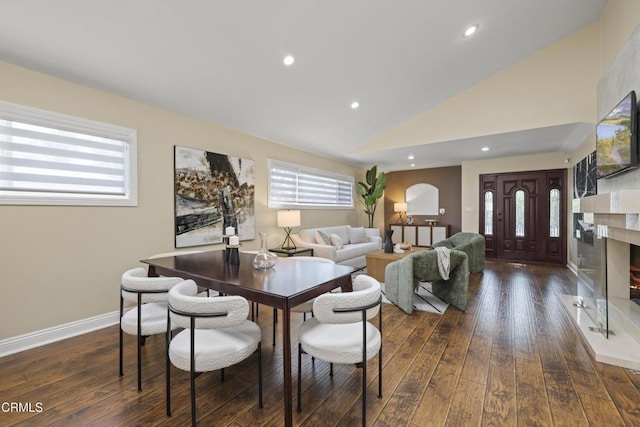 4961 Alcove Ave, Valley Village, CA 91607 - dining room featuring dark wood-style flooring, vaulted ceiling, recessed lighting, and a fireplace