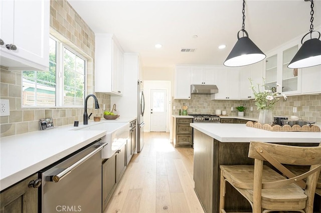 240 Rosemont Blvd, San Gabriel, CA 91775 - kitchen featuring stainless steel appliances, under cabinet range hood, plenty of natural light, light wood-style flooring, and recessed lighting