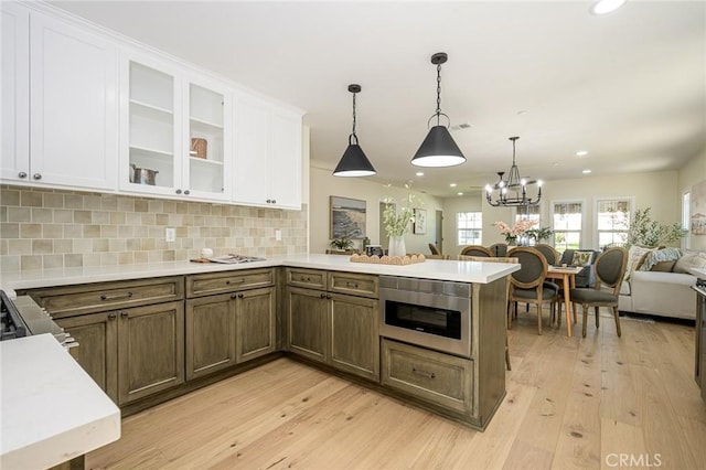 240 Rosemont Blvd, San Gabriel, CA 91775 - kitchen featuring open floor plan, light countertops, light wood-style floors, white cabinets, and a peninsula