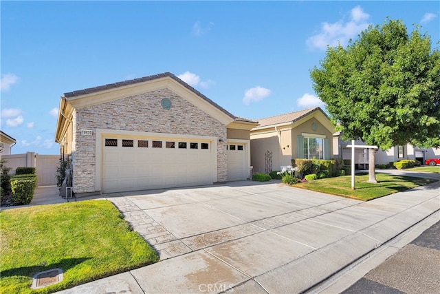 19570 Vermillion Ln, Apple Valley, CA 92308 - ranch-style home featuring stone siding, an attached garage, driveway, and stucco siding