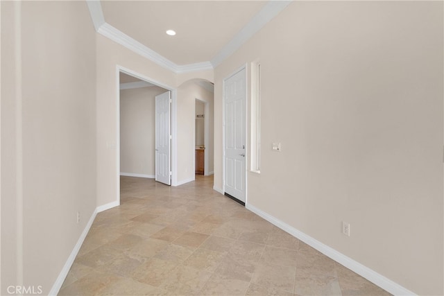 19570 Vermillion Ln, Apple Valley, CA 92308 - hallway with arched walkways, crown molding, light stone finish flooring, and recessed lighting