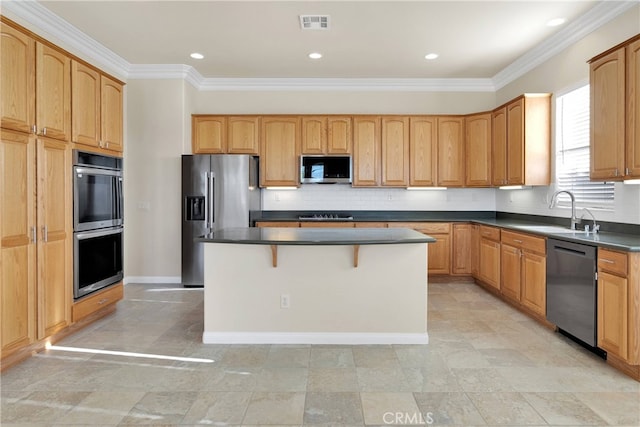 19570 Vermillion Ln, Apple Valley, CA 92308 - kitchen featuring stainless steel appliances, a kitchen island, dark countertops, ornamental molding, and backsplash