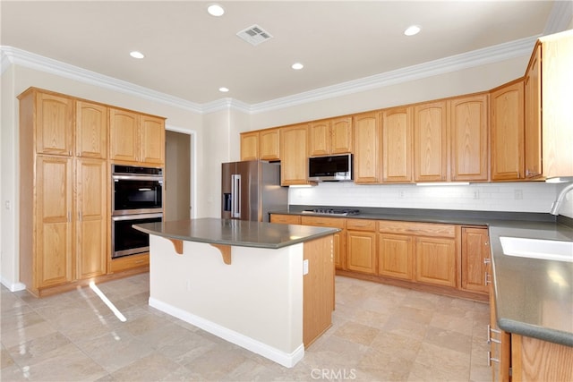 19570 Vermillion Ln, Apple Valley, CA 92308 - kitchen with stainless steel appliances, dark countertops, a center island, backsplash, and ornamental molding