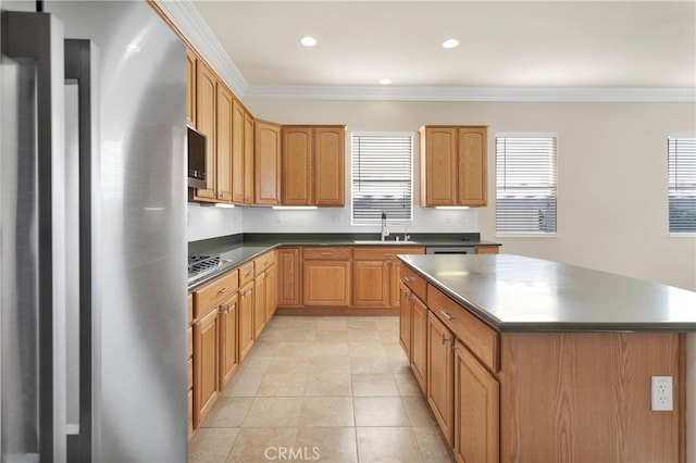 19570 Vermillion Ln, Apple Valley, CA 92308 - kitchen with appliances with stainless steel finishes, dark countertops, crown molding, a kitchen island, and recessed lighting