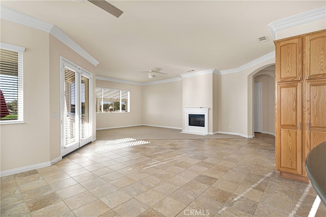 19570 Vermillion Ln, Apple Valley, CA 92308 - unfurnished living room with ceiling fan, stone tile flooring, crown molding, arched walkways, and a fireplace