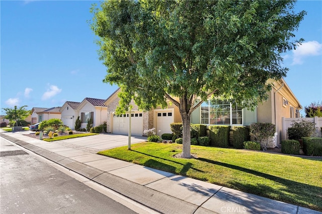 19570 Vermillion Ln, Apple Valley, CA 92308 - view of front of property with driveway, a front yard, an attached garage, stucco siding, and a residential view