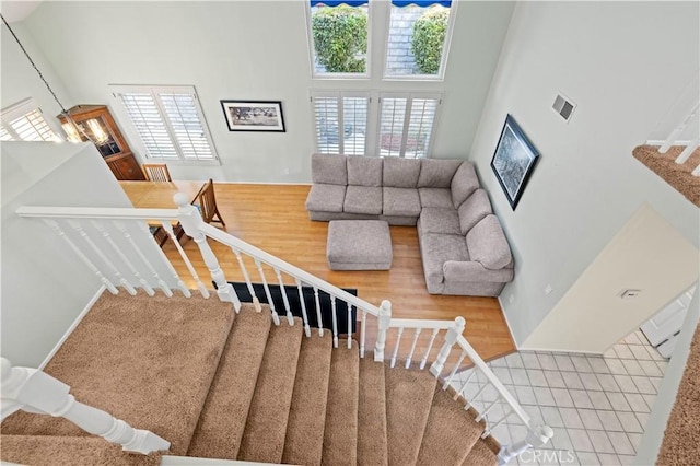 28610 Cloverleaf Pl, Castaic, CA 91384 - stairs featuring a high ceiling and wood finished floors